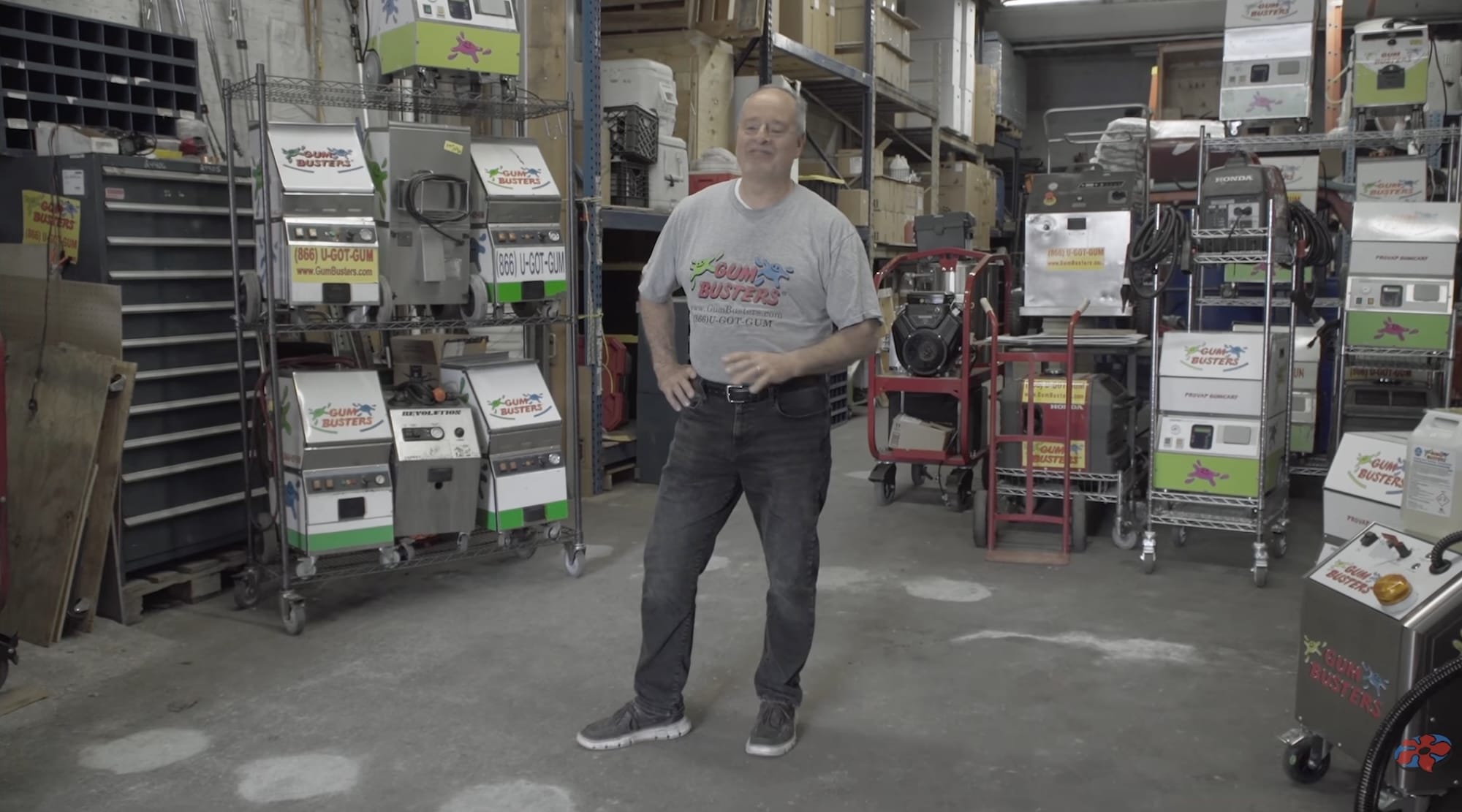 a still from the movie 'The History of Concrete' featuring a man who runs a company called Gum Busters