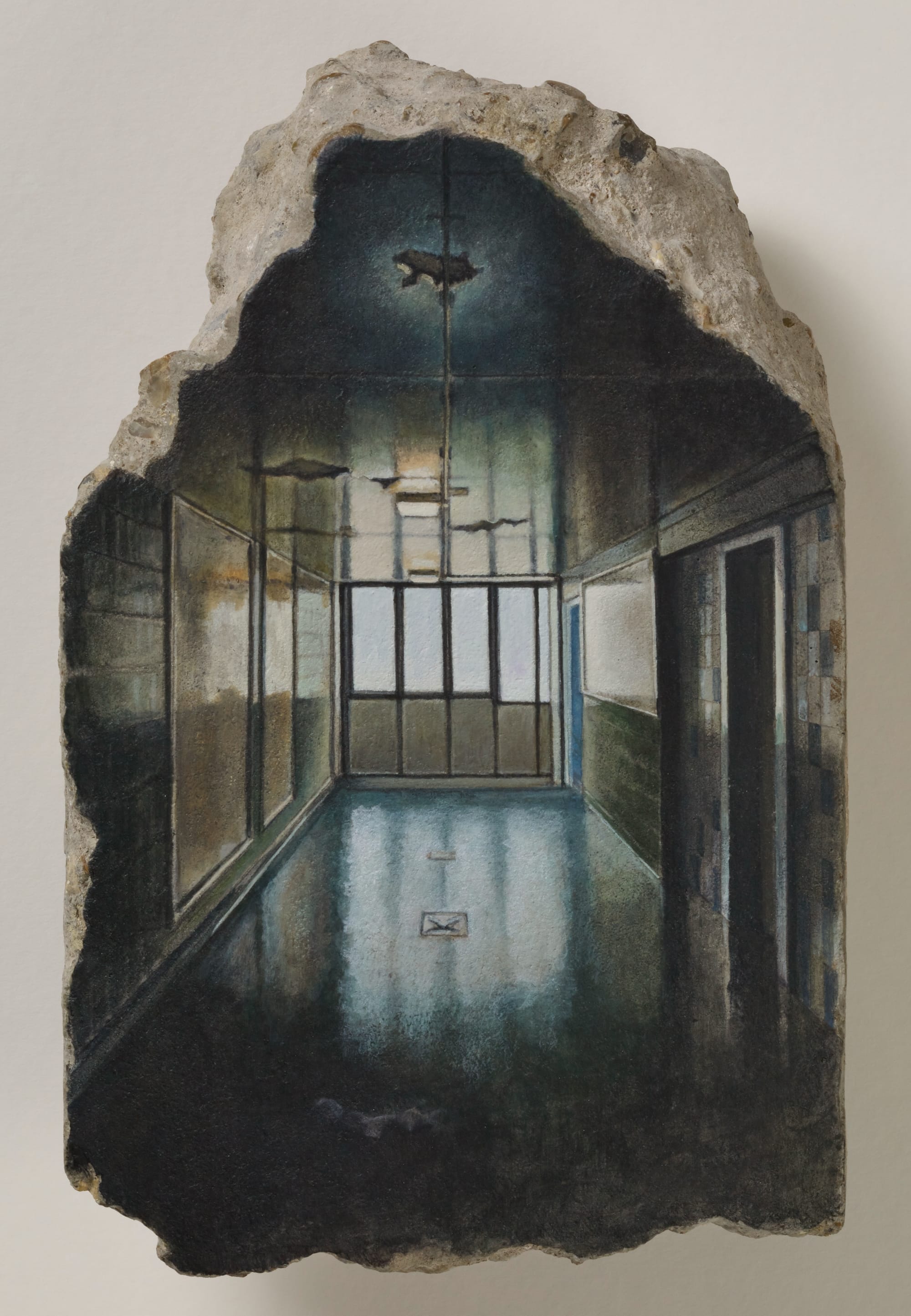a concrete fragment with a painting of a room with standing water