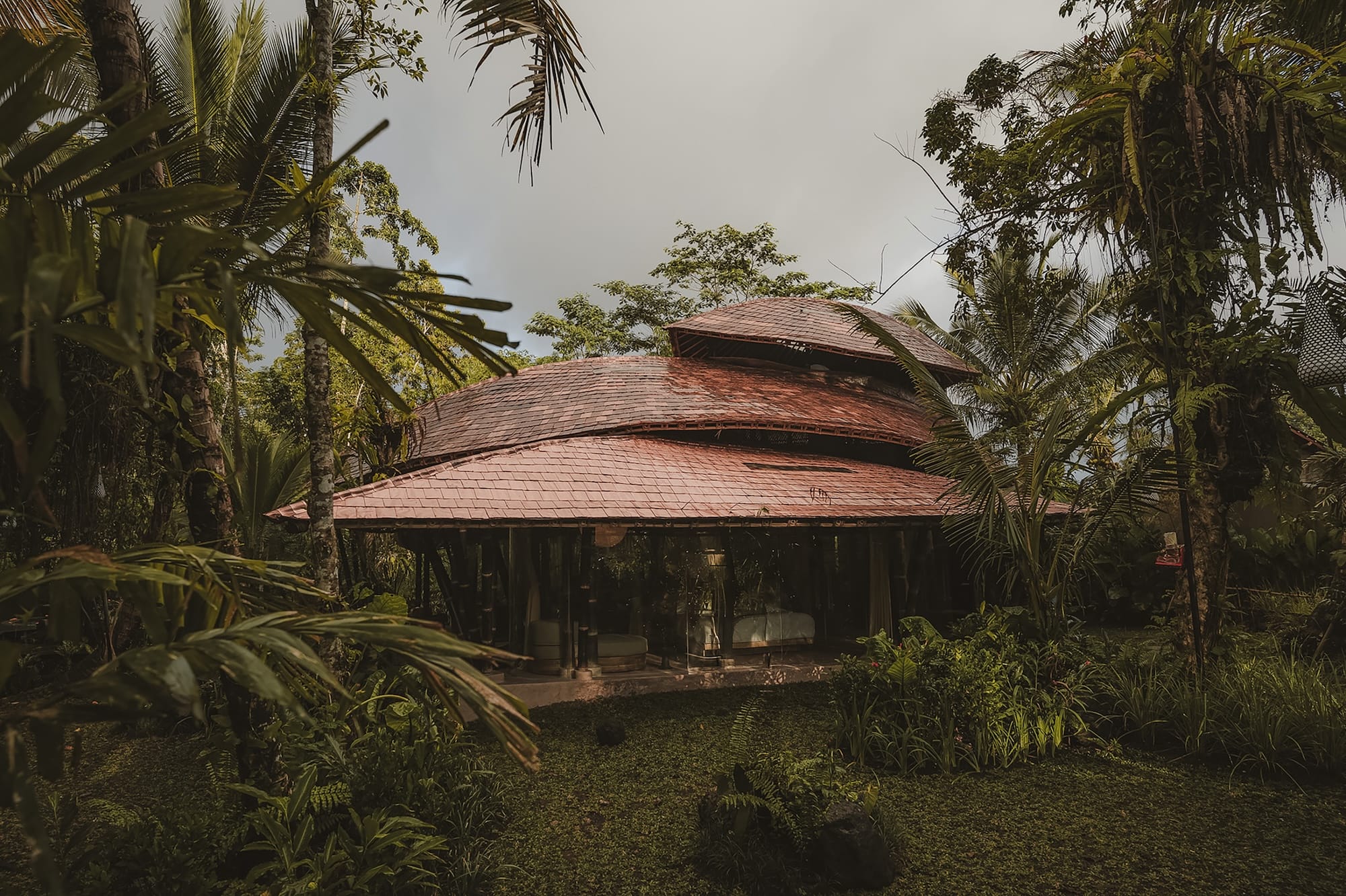 a view of wooden architecture with organic-shaped rooflines and layers