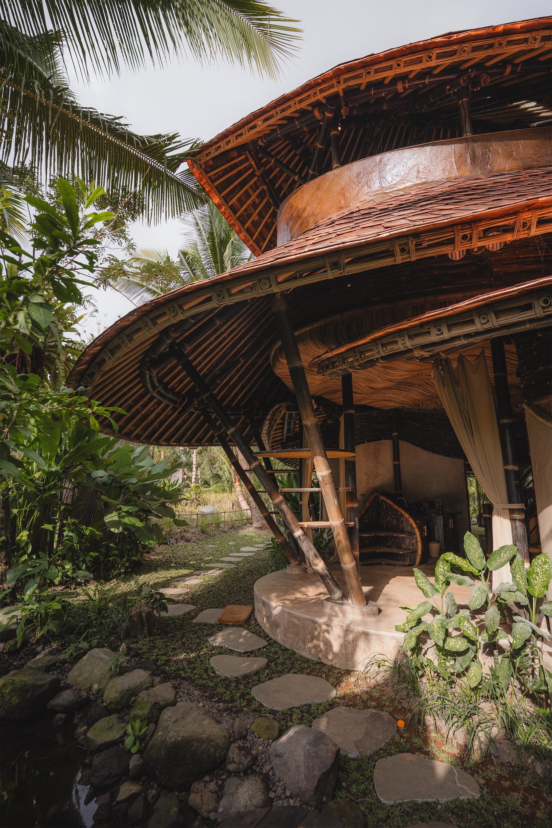 a view of wooden architecture with organic-shaped rooflines and layers