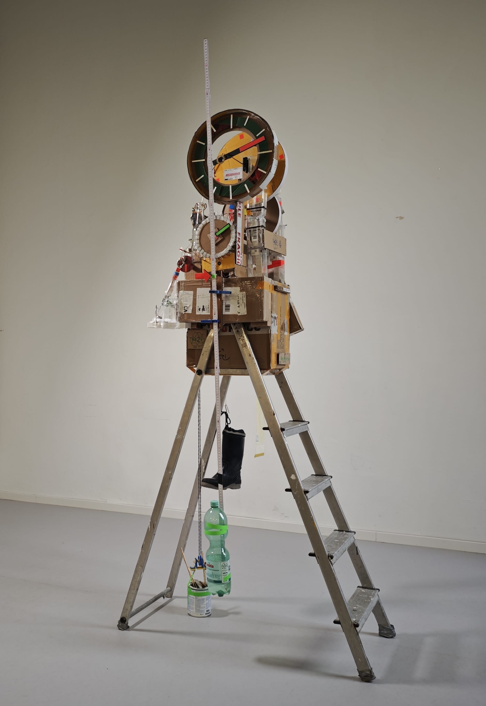 a sculptural, functional clock made from foraged trash