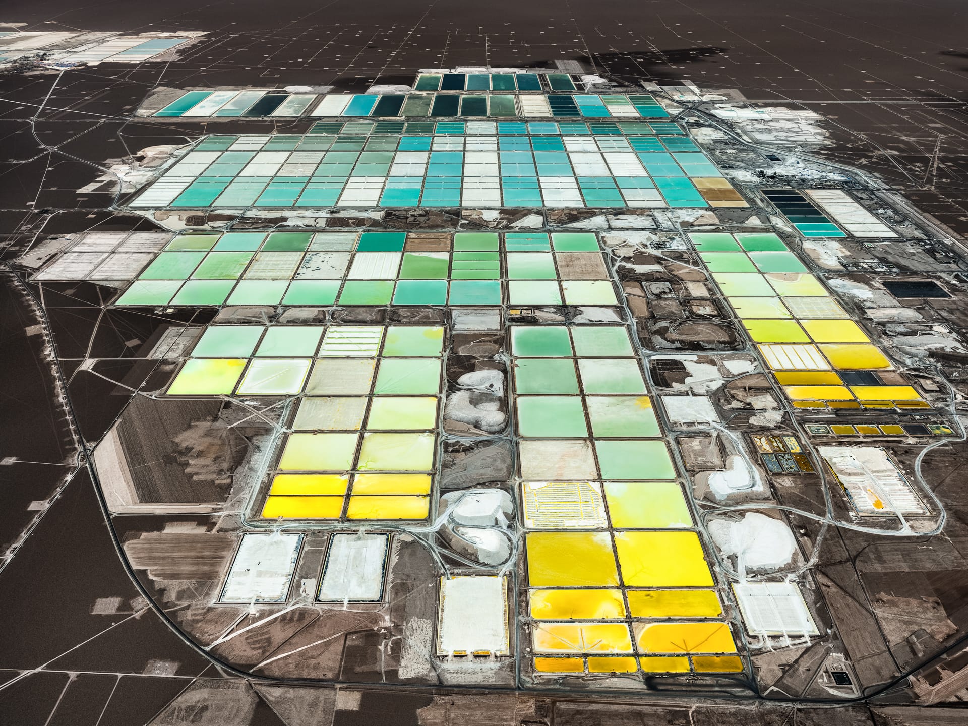 an aerial photo by tom hegen of a vast mining landscape 