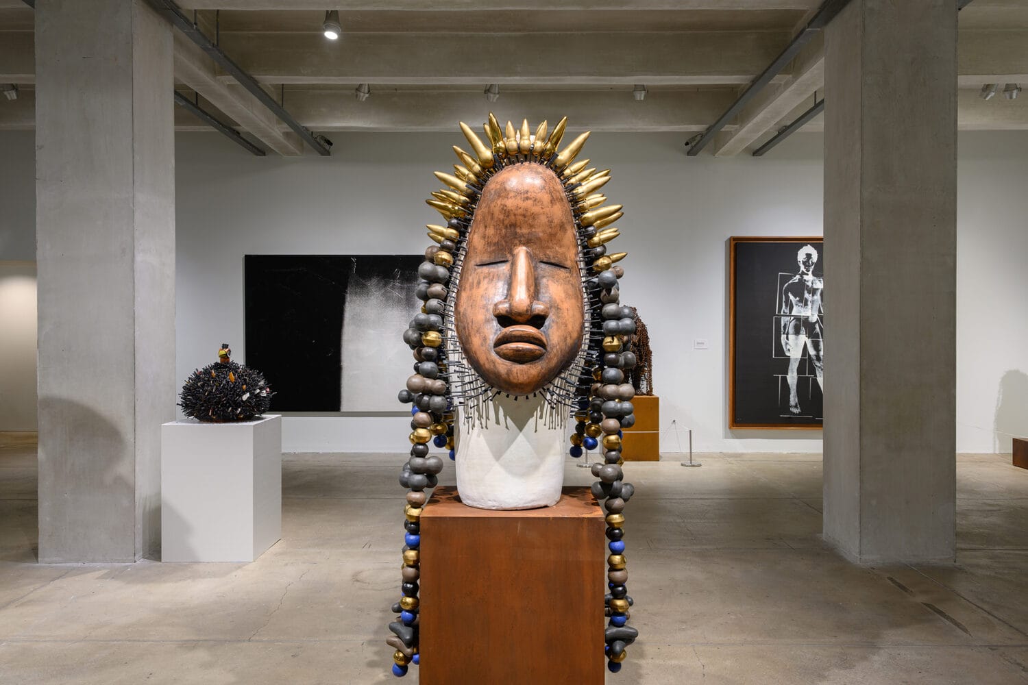 installation view of a show of sculptures and paintings by Sharif Bey
