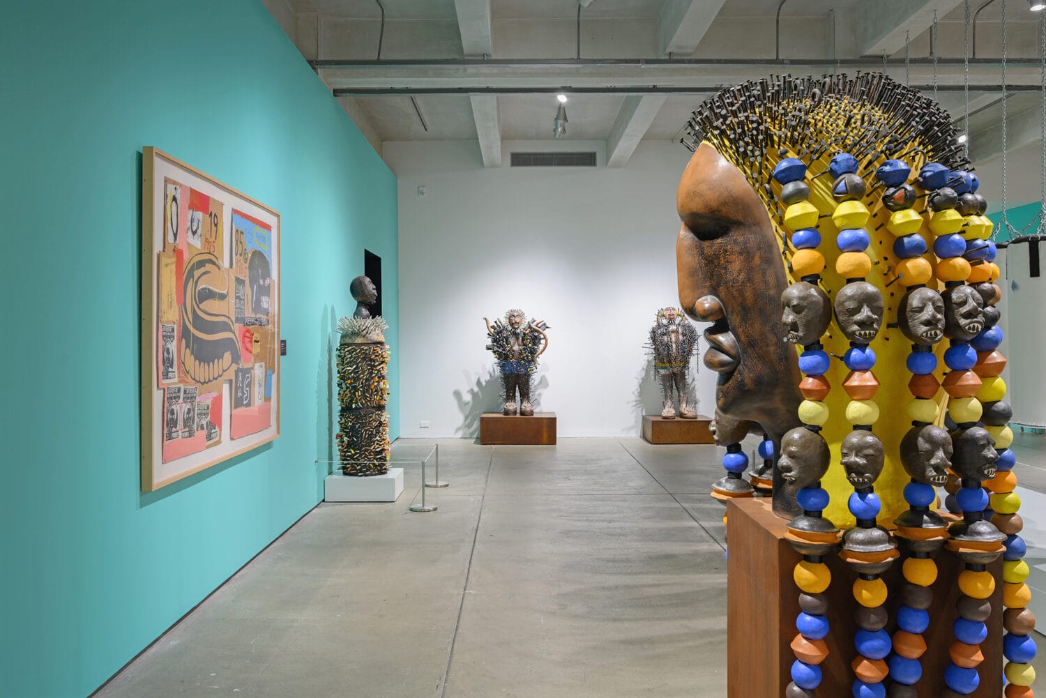 installation view of a show of sculptures and paintings by Sharif Bey