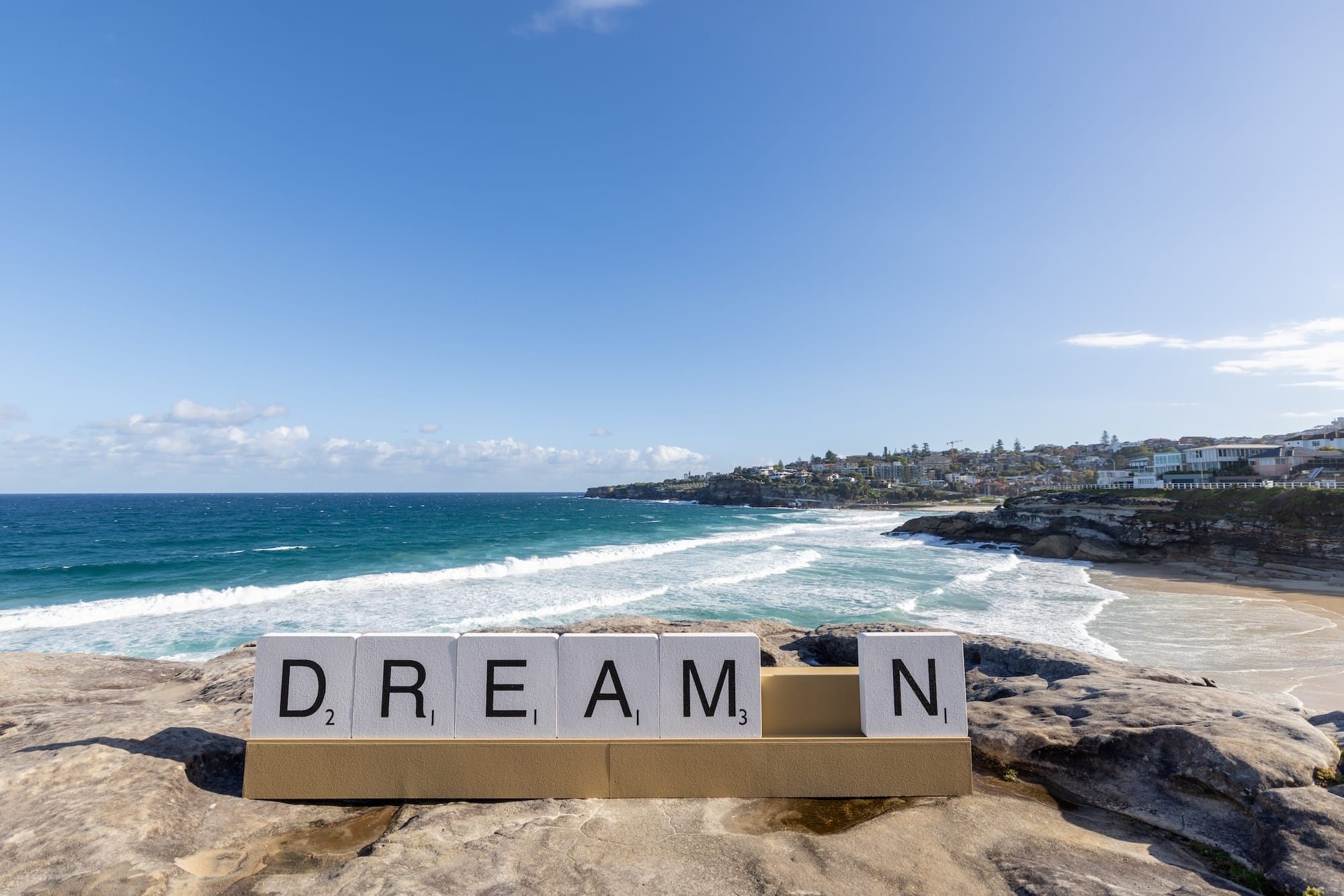 a sculpture at Bondi Beach, NSW, Australia, with large Scrabble letters that read "DREAM N"