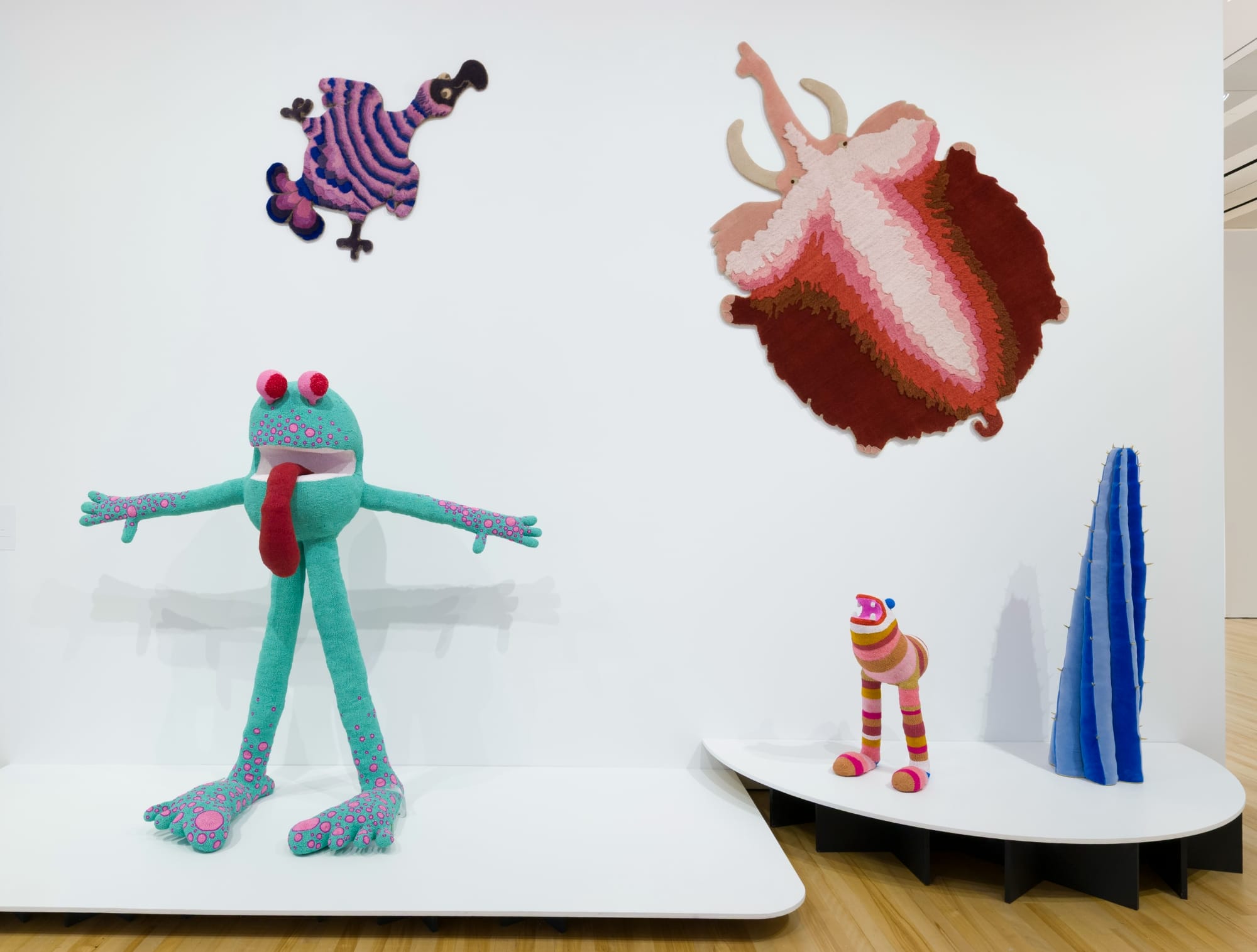 fantastical creatures by the haas brothers on the wall and as freestanding sculptures