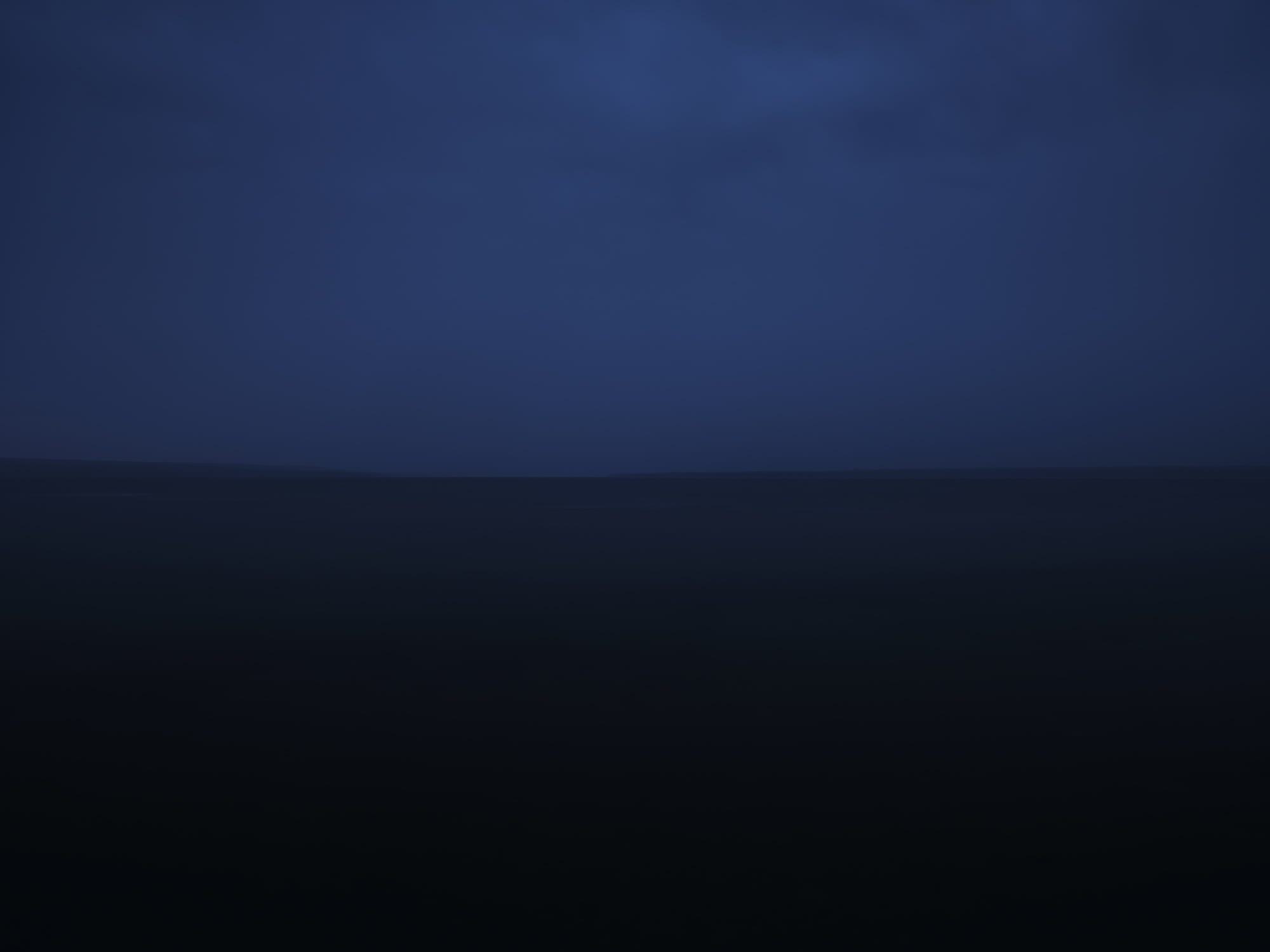 a dark, moody image of an open body of water