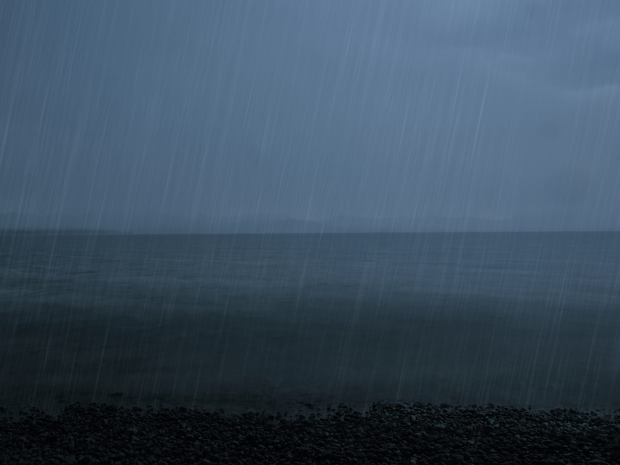 an open body of water on a rainy day