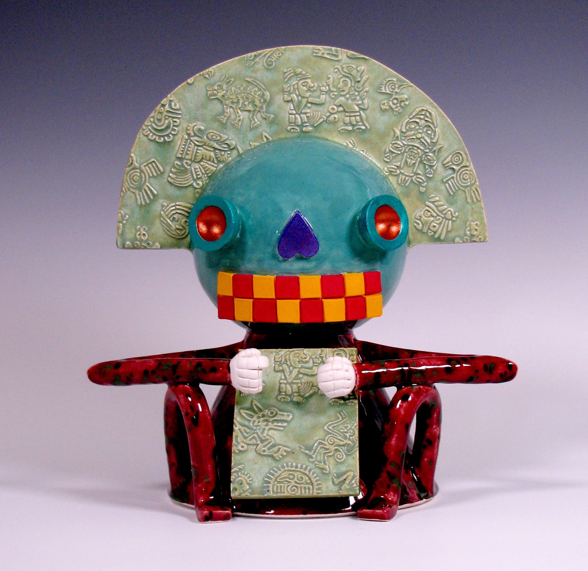 a colorful, abstract, ceramic sculpture of a cartoonish figure by Max Lehman inspired by ancient Mayan carvings