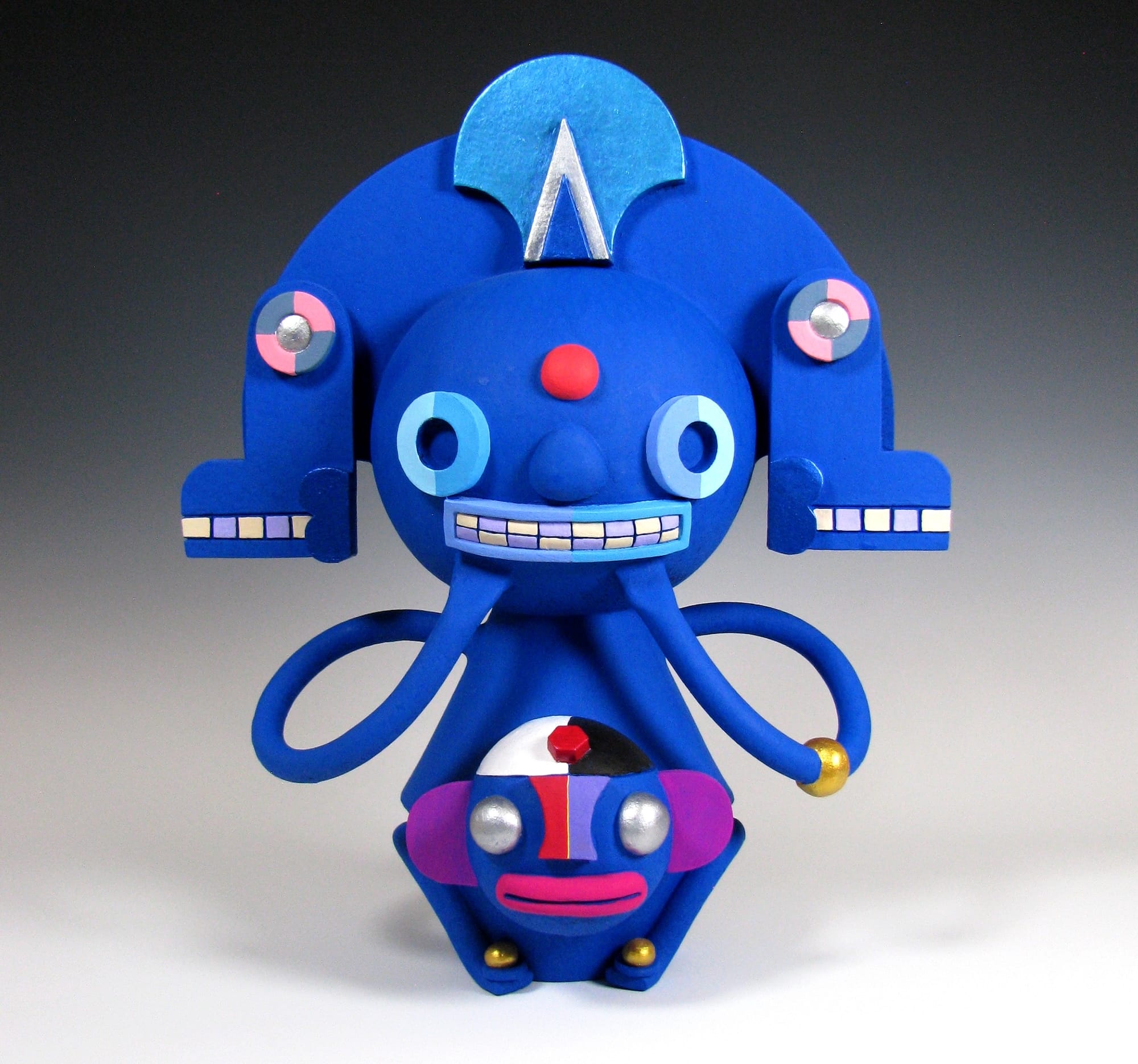 a colorful, abstract, ceramic sculpture of a cartoonish figure by Max Lehman inspired by ancient Mayan carvings