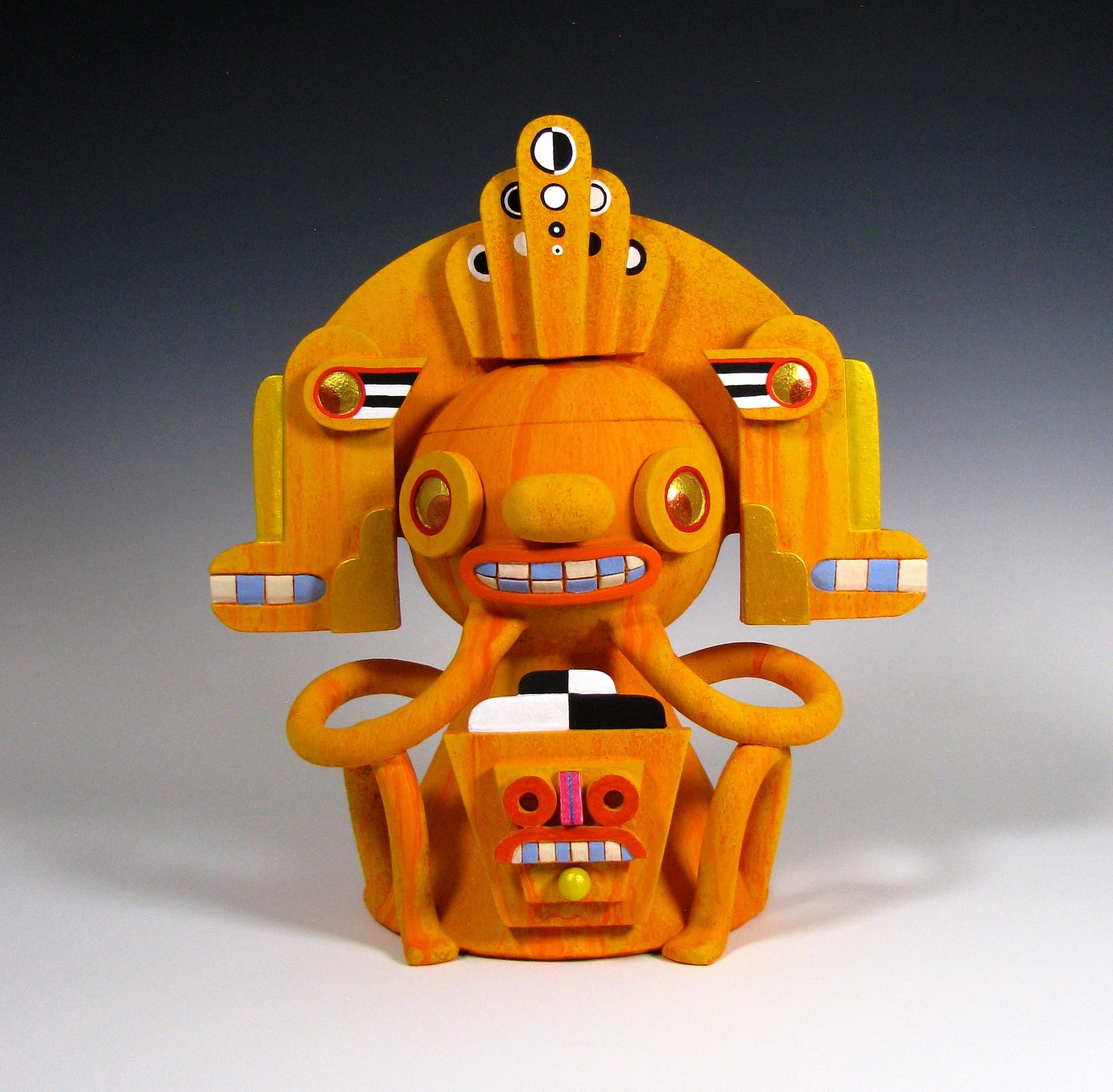 a colorful, abstract, ceramic sculpture of a cartoonish figure by Max Lehman inspired by ancient Mayan carvings