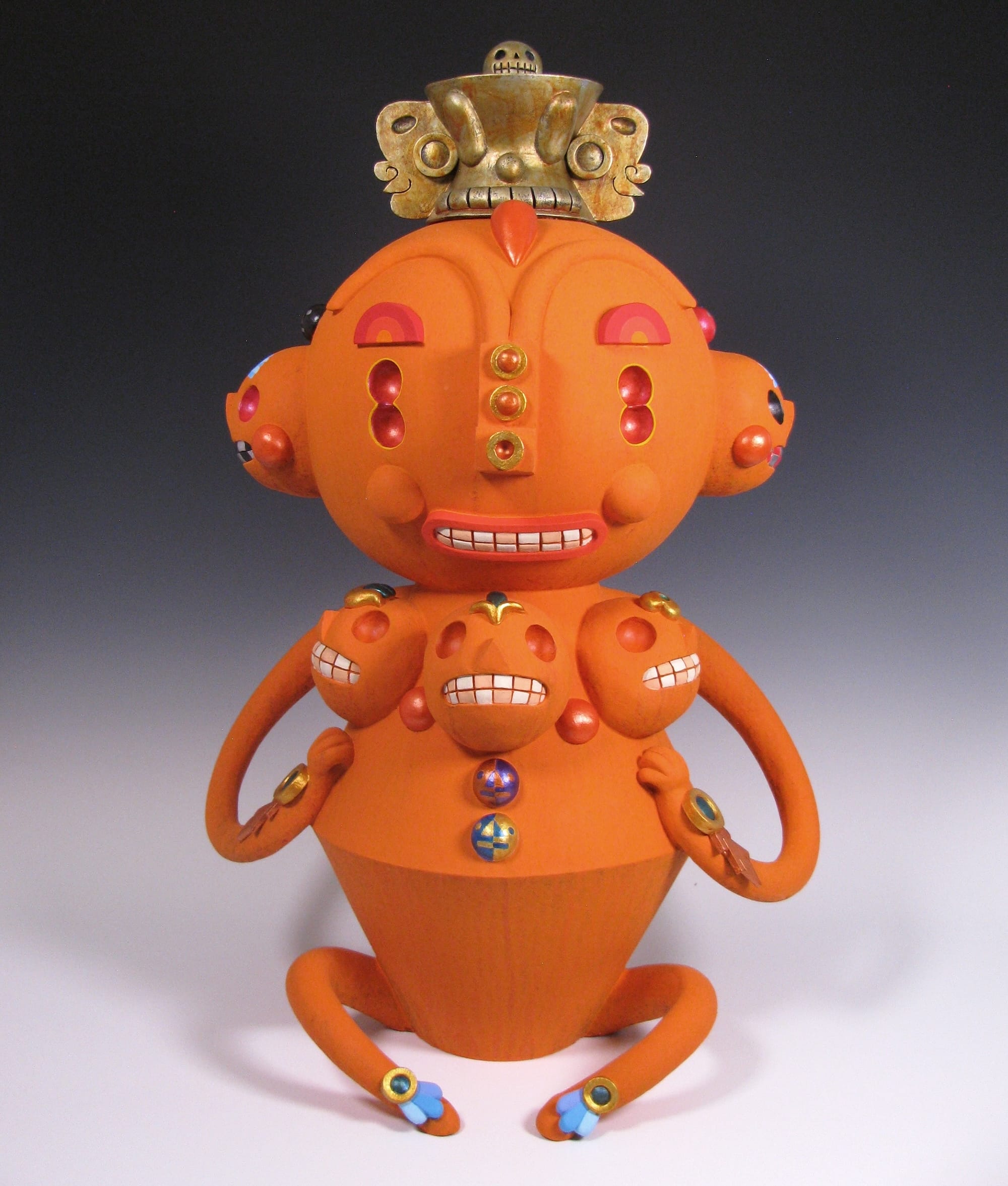 a colorful, abstract, ceramic sculpture of a cartoonish figure by Max Lehman inspired slightly by ancient Mayan carvings
