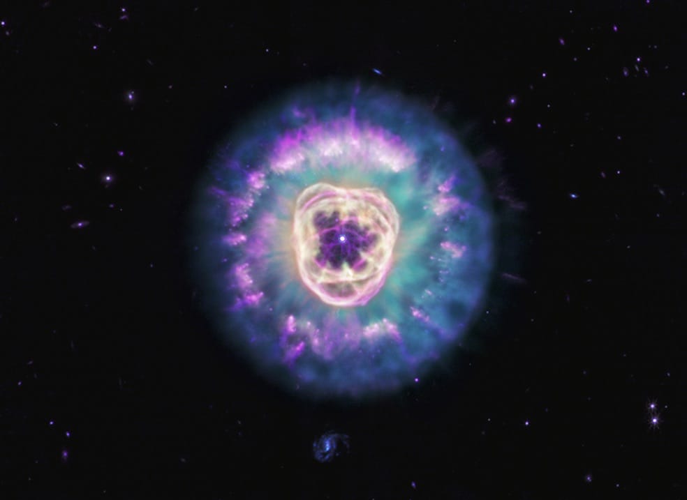 a large circular nebula in a dark sky