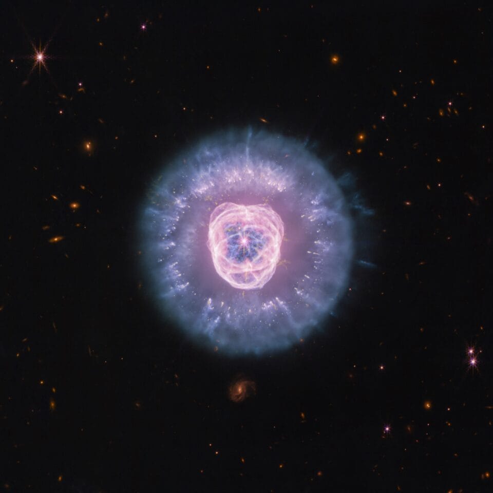 a large circular nebula in a dark sky