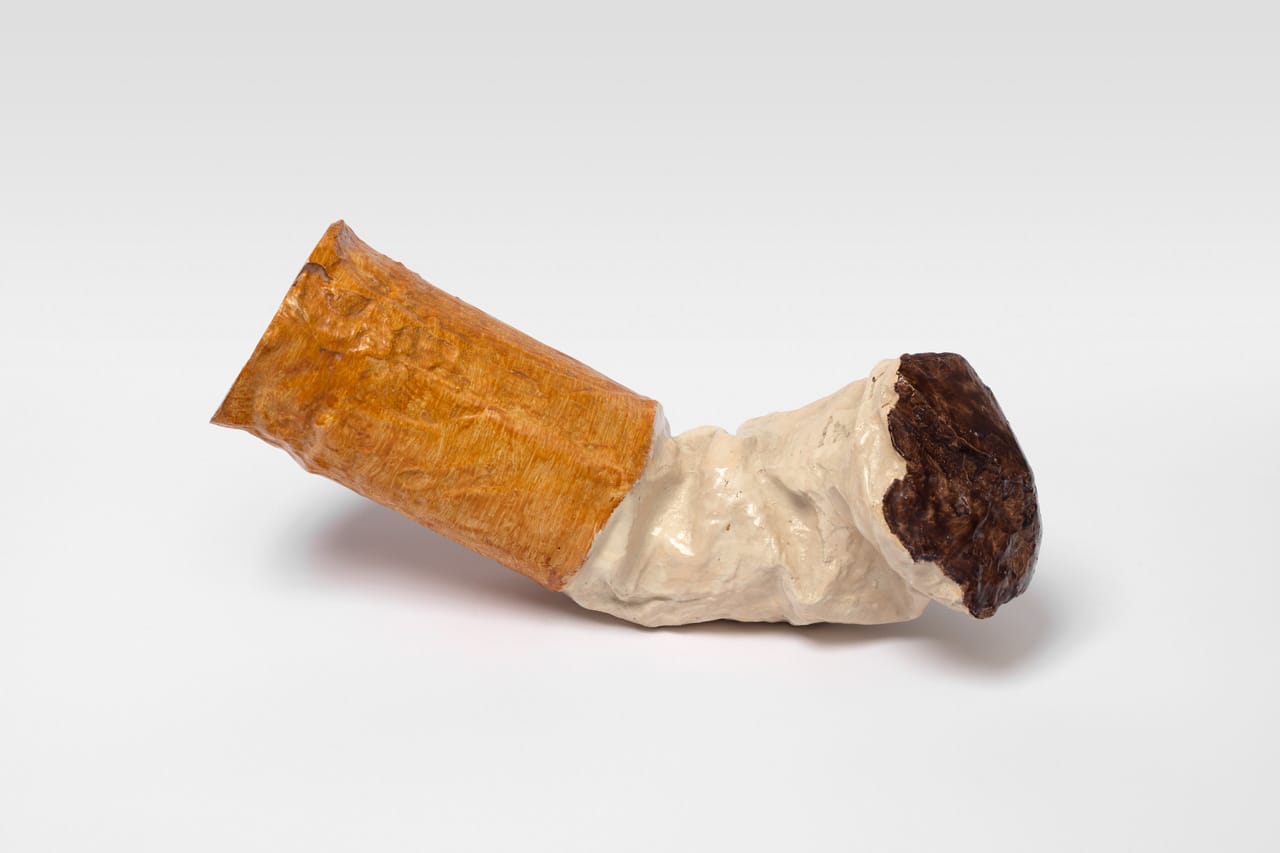 a sculpture of a crumpled cigarette butt