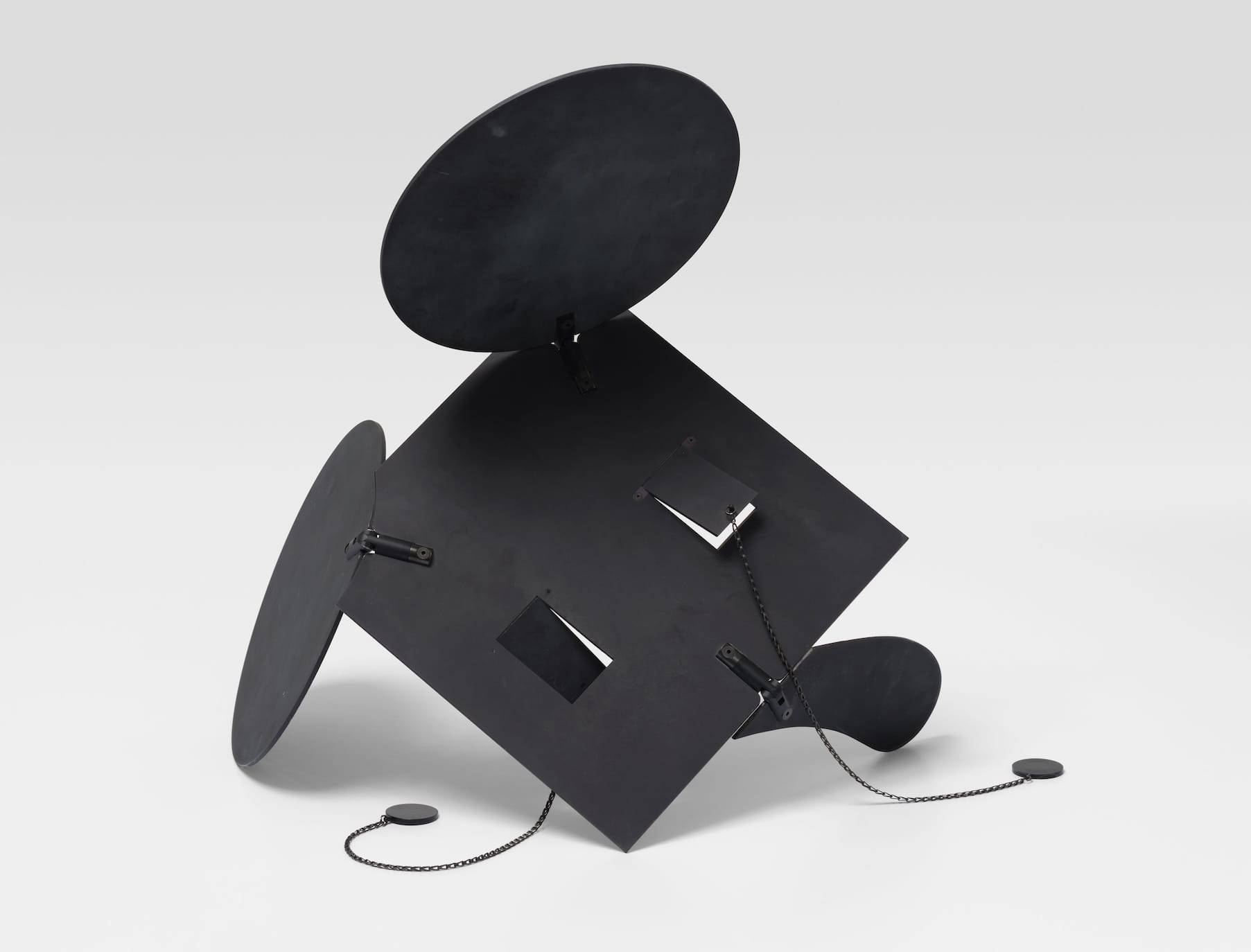 a black, geometric sculpture of a mouse