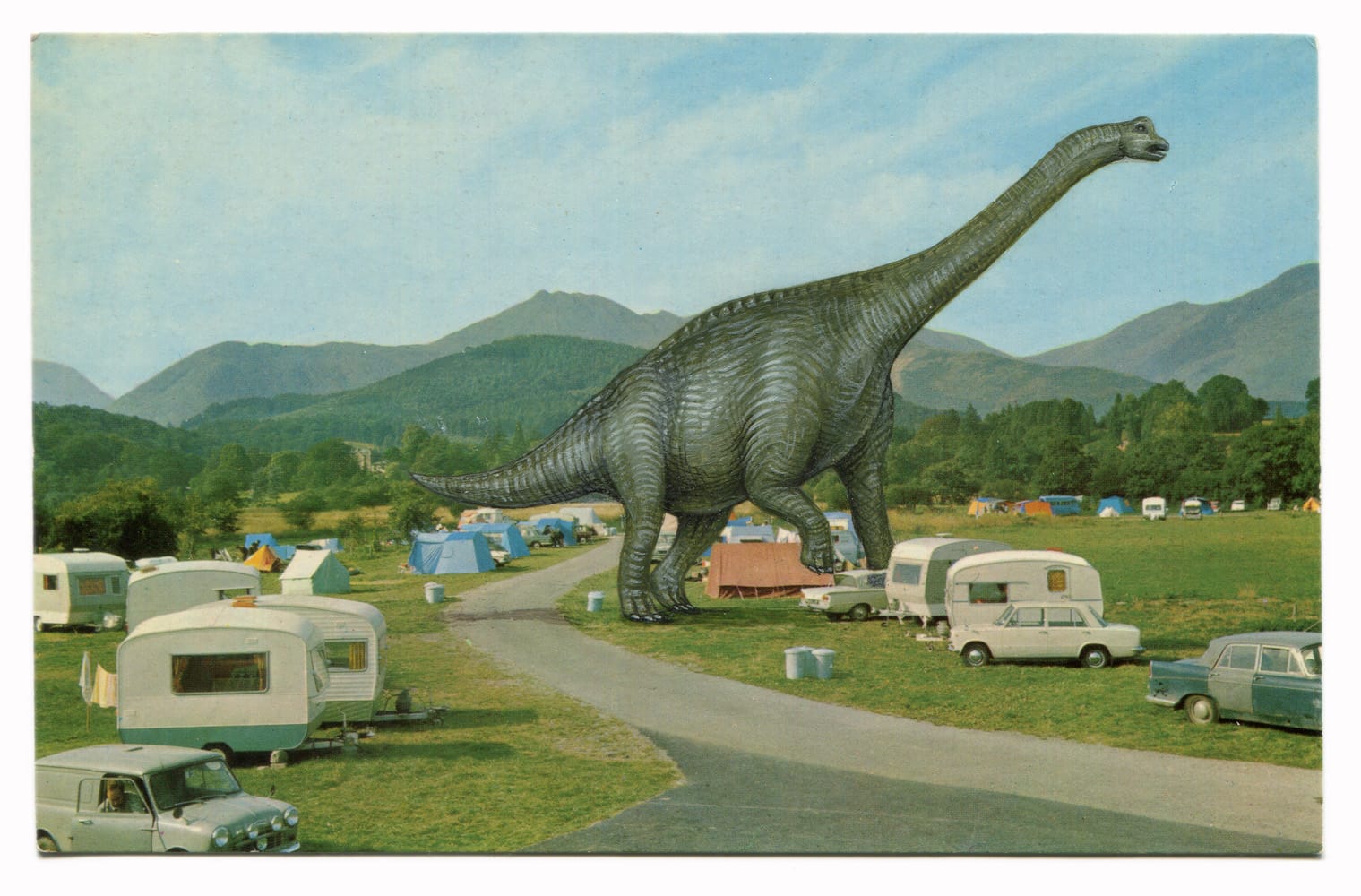 a painting by Rose Sanderson on a vintage postcard of a dinosaur wandering through a campground